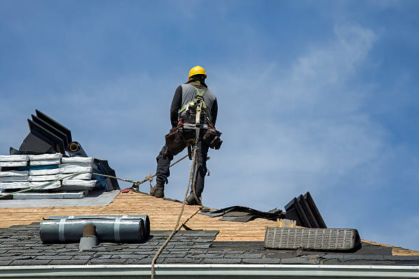 Professional Roof Replacement technician working in Estero, FL